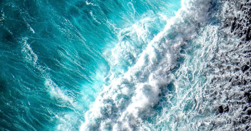 Aerial photo of an ocean wave breaking